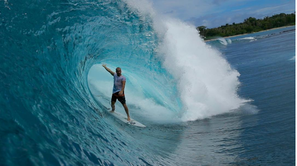 Surfer in a perfect barrel in the Mentawai Islands