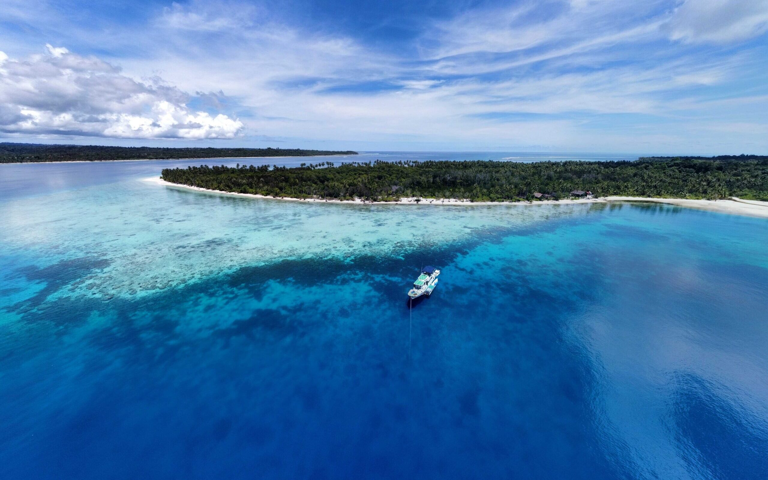 The Saraina surf charter boat cruising in the Mentawai Islands while hunting for perfect waves and barrels